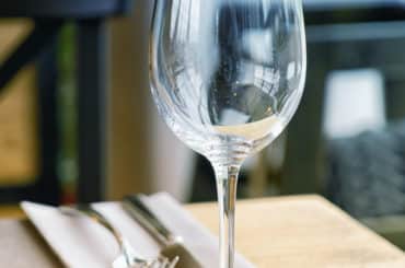 glass on table at restaurant financial planning